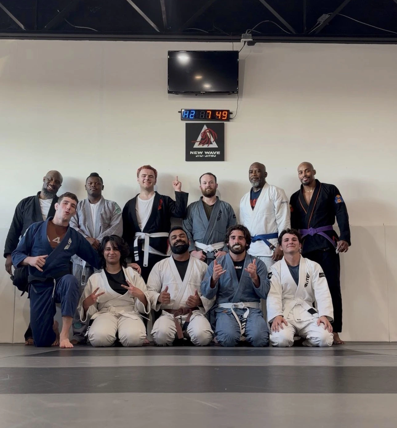 The adult class together on the mats at New Wave Jiu Jitsu